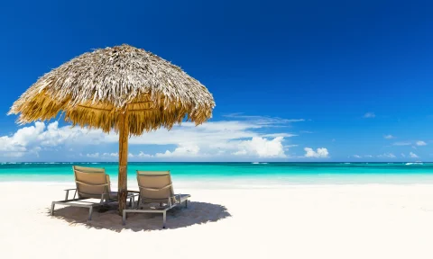 bigstock-beach-chairs-with-umbrella-and-129286676